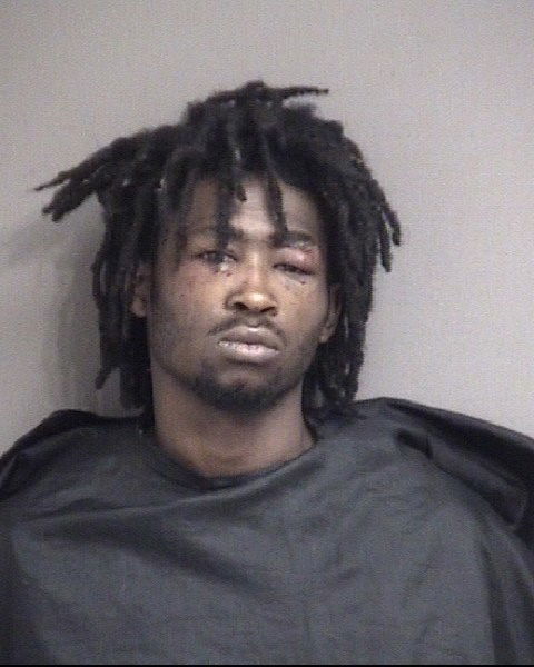 Man charged after allegedly firing gun into multiple apartment walls