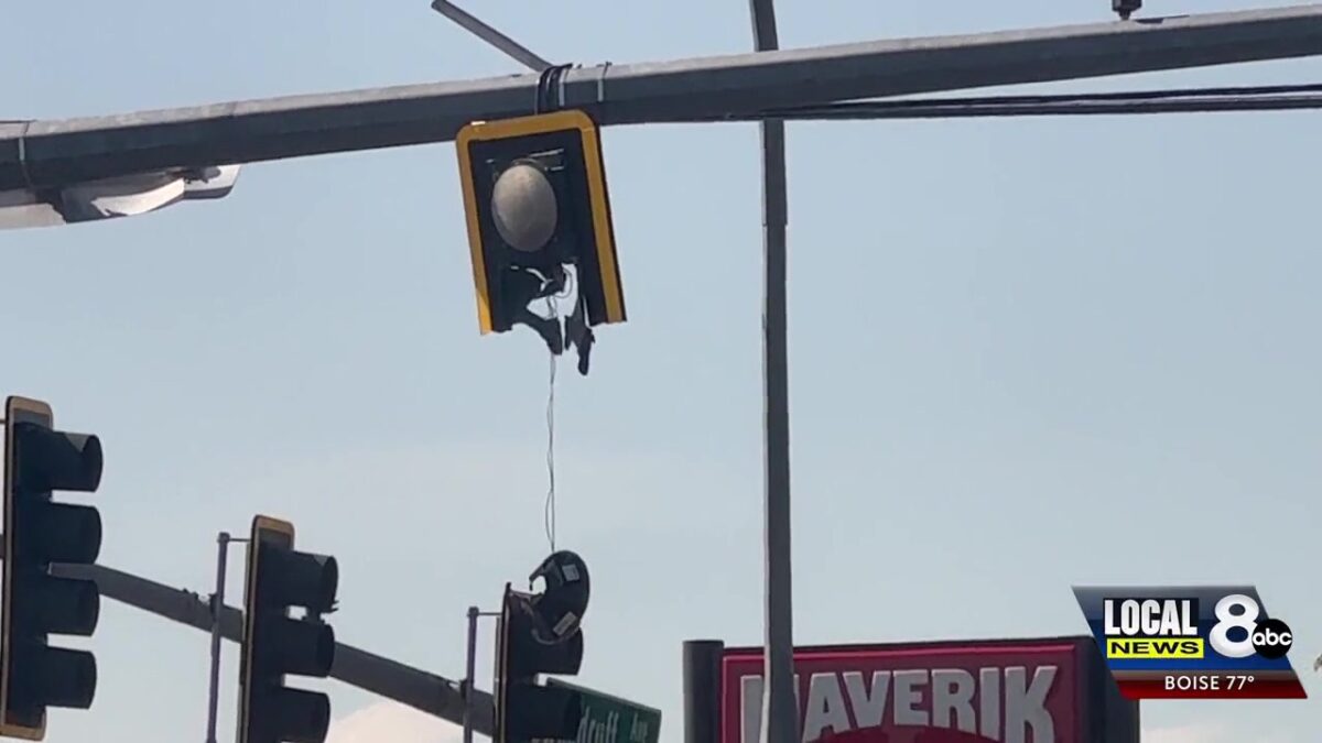 Police redirect traffic after dump truck strikes light at 1st and Woodruff