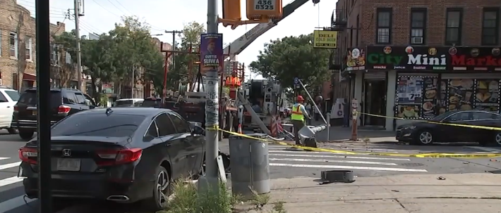 A man was injured after being hit by a car driven by a 15-year-old while standing on a curb in Brooklyn.