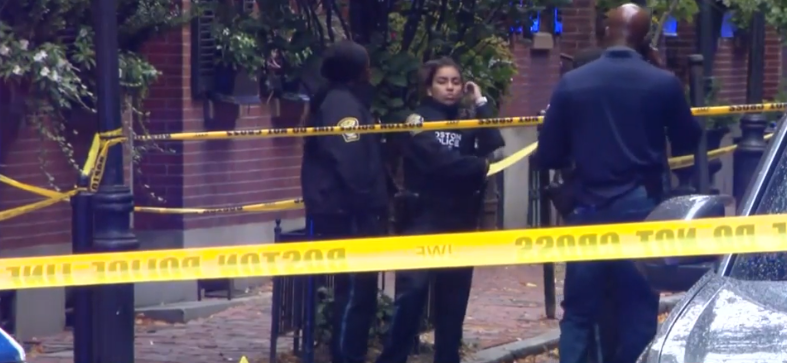 A man with a knife was shot by police in Boston's Beacon Hill neighborhood after officers responded to a 911 call for a breaking and entering at a restaurant