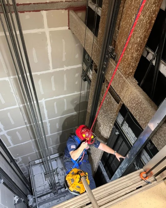 Firefighters used a rope method to reach and rescue a person who was in a stuck elevator Sept. 28