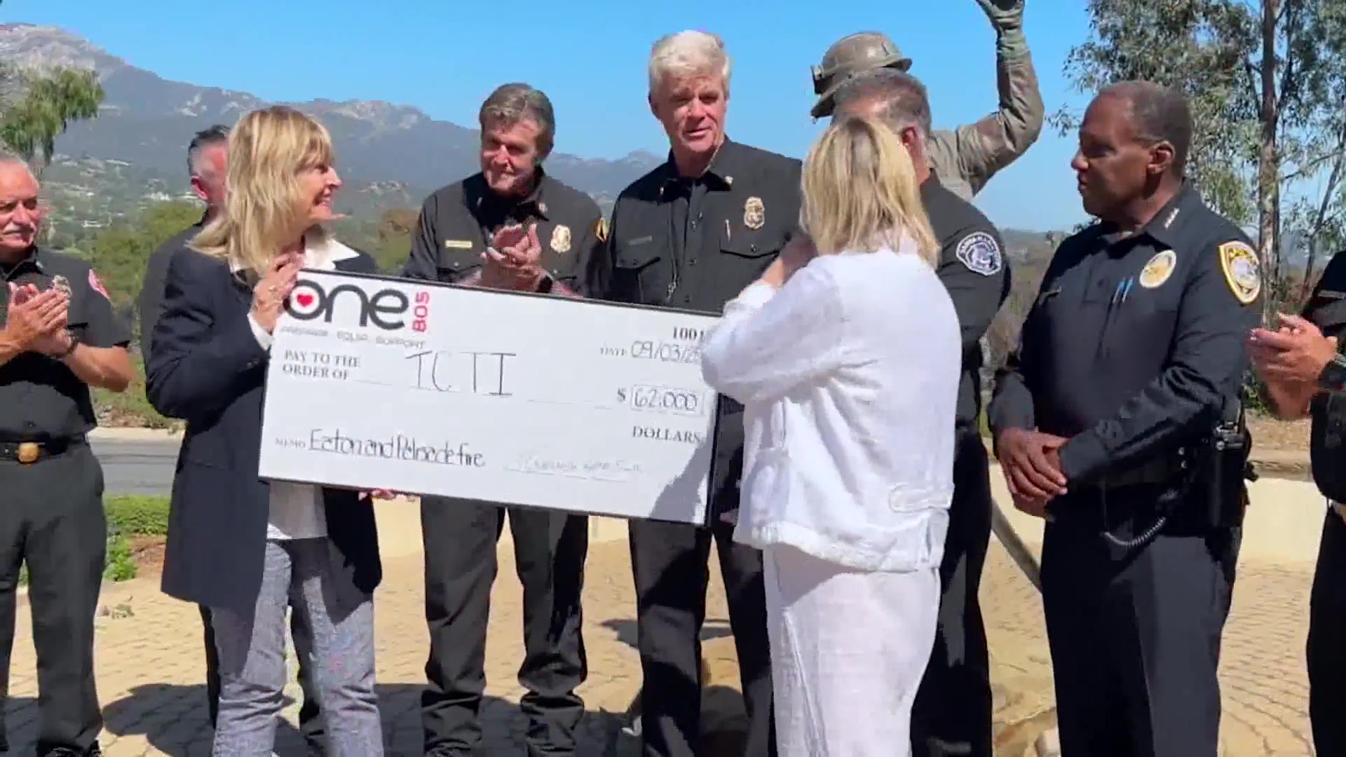 One805 Presents Check to The Counseling Team International