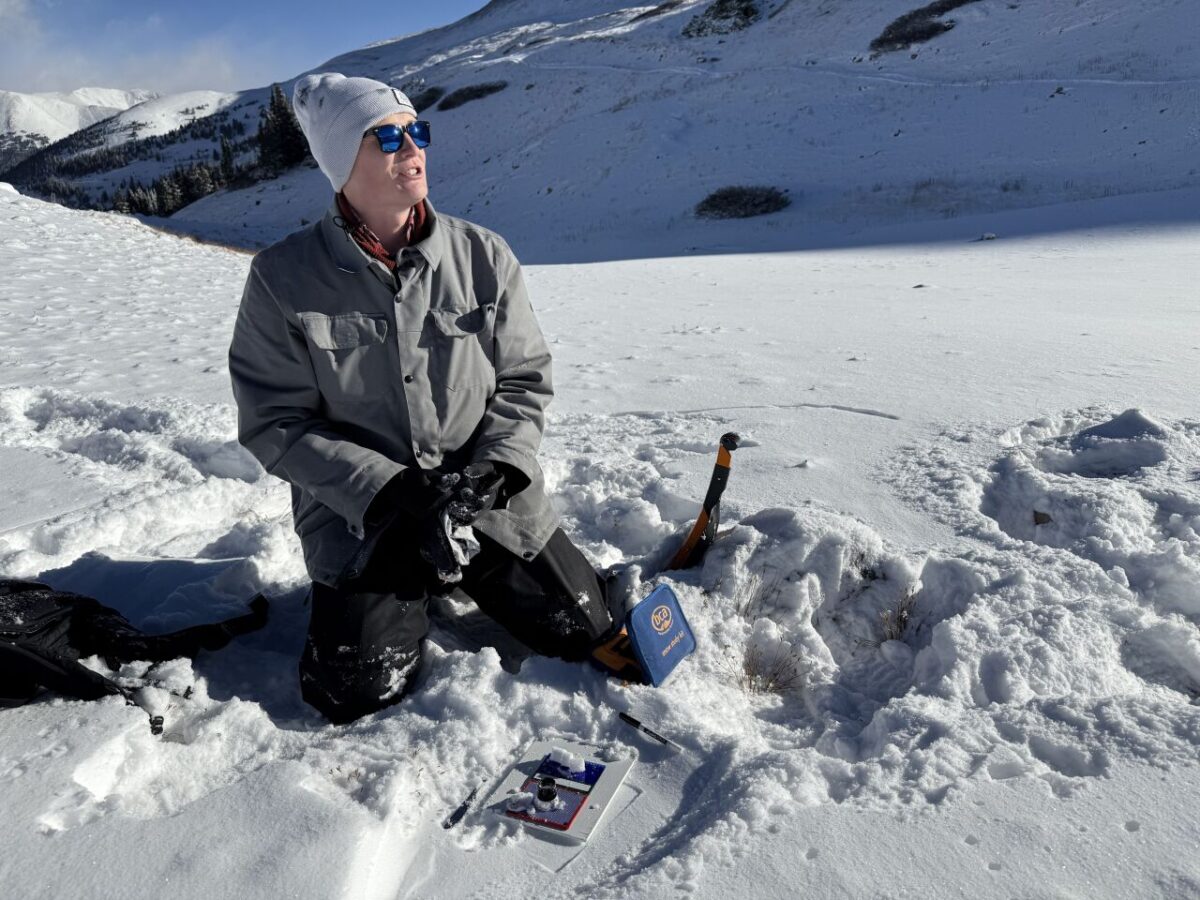 Denny Schaedig collects snow samples at Loveland Pass.