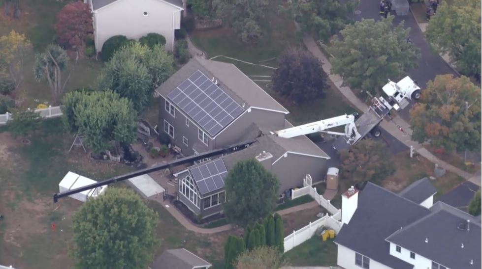 The arm of the crane collapsed as it was moving a hot tub into a home's backyard on Lea Drive in Hamilton Township