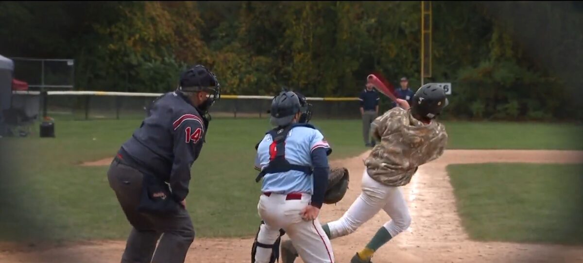 Baseball players gathered for a game in Quincy