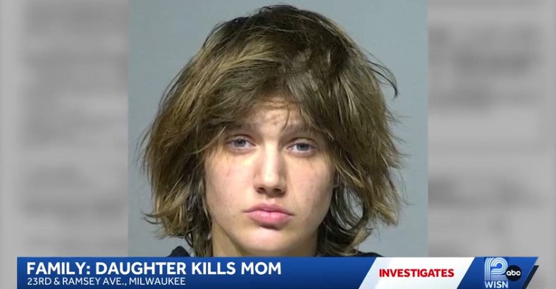 The warrant states that officers found Spors "covered in blood" and arrested her.