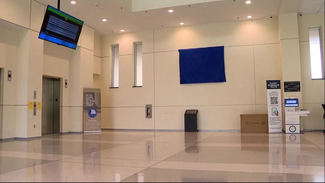 An American flag that flew outside the Buncombe County Detention Facility and was recovered after Helene is now on display as a reminder of the community's resilience.