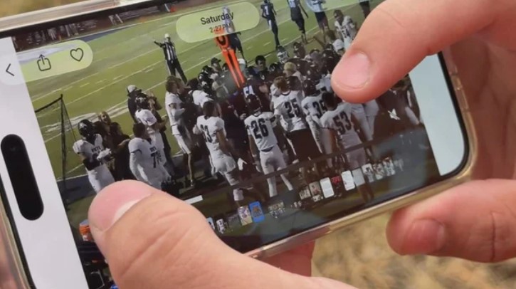 Mountain Vista football player Kade Ingrassia shows video taken by a spectator of Friday's game.