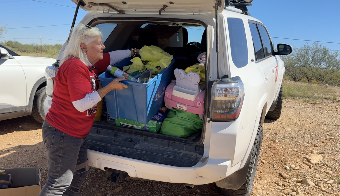Gail unloading dog food and other supplies.
