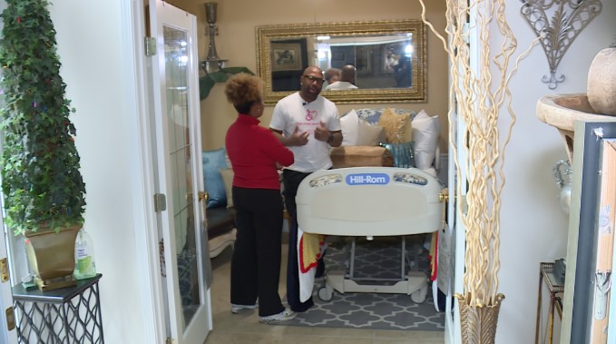 Watkins shows KSHB 41's Rachel Henderson his mother's memorial room in his home.