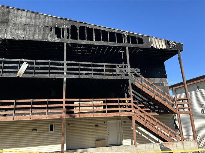 Police arrested a 40-year-old man after he allegedly set fire to his apartment building in Pullman and led officers on a car chase that ended in a three-hour standoff.