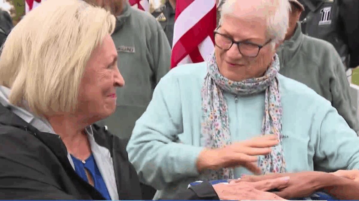 Barbara Aker and Carol Woosley have received a flag from the final salute of an Iowa Civil War veteran