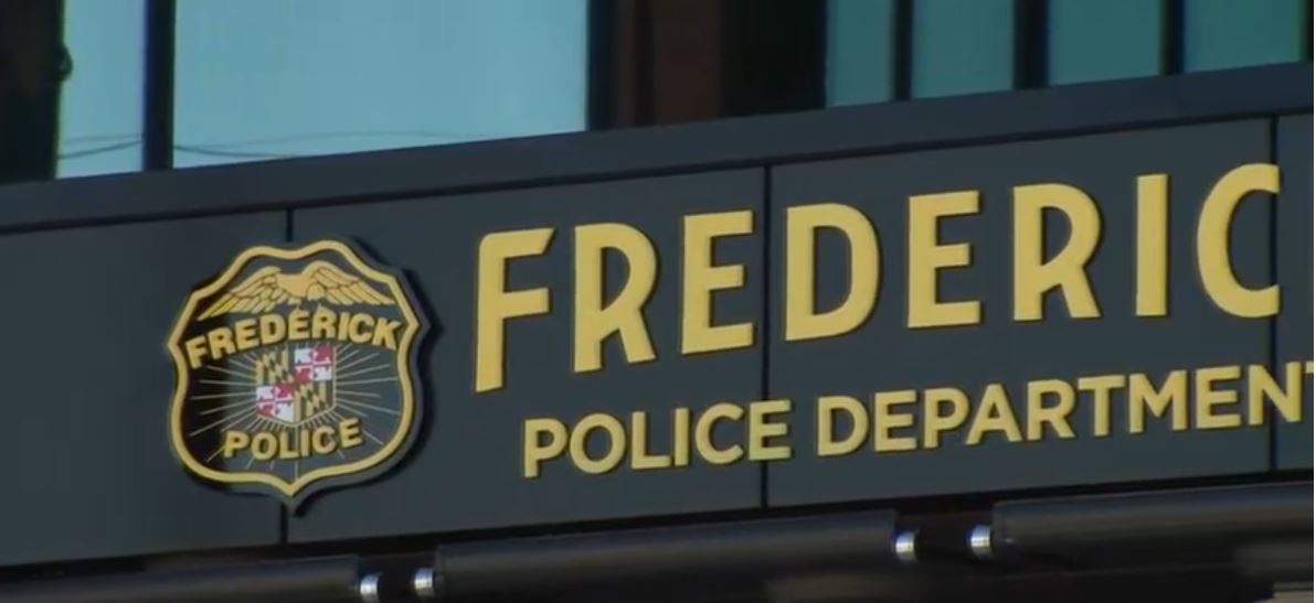 A police investigation is underway after a bizarre call to a radio station led officers to a body in a wooded area in Frederick.