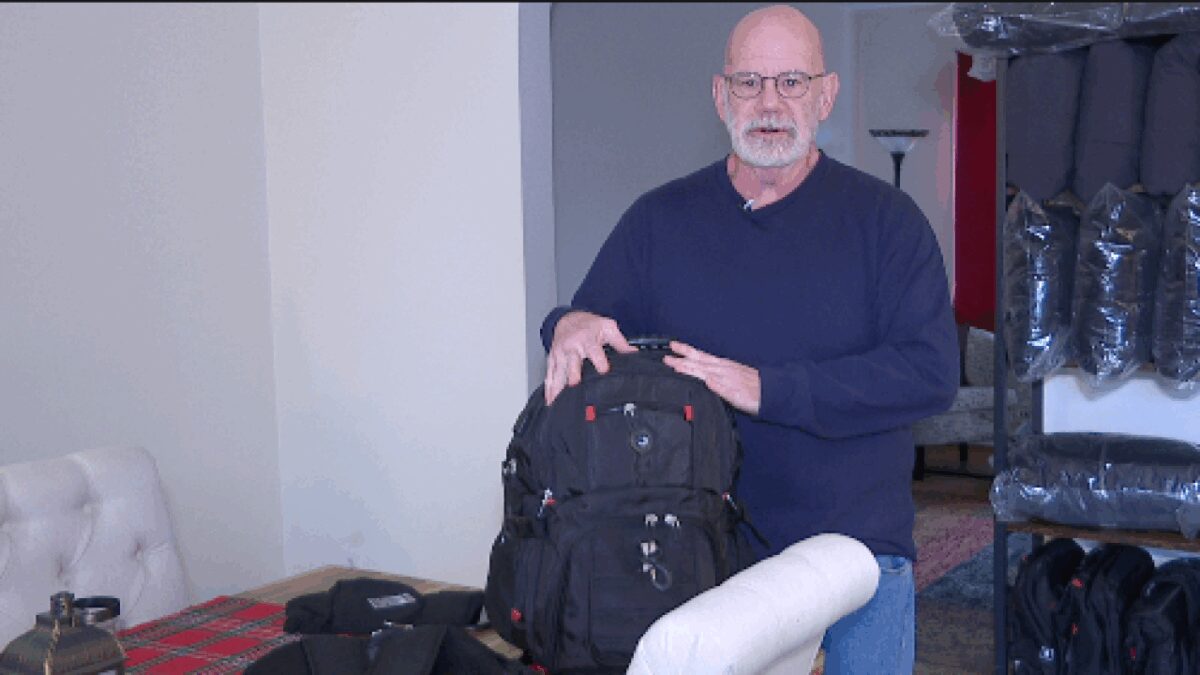 Towson resident Robert Williams holds a backpack he filled with winter accessories as part of his CALM Outreach to homeless people on the Towson streets. Williams will sleep on the streets Thanksgiving night to draw awareness to homelessness.