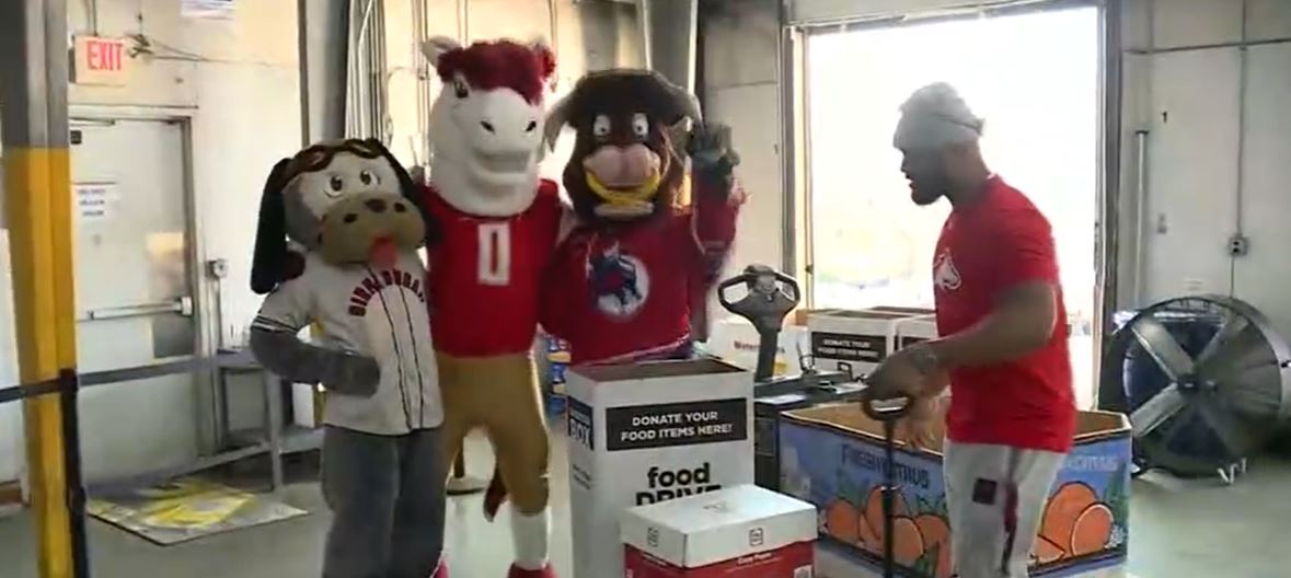 Volunteers at the Community Food Bank of Central Alabama are packaging and wrapping holiday boxes full of the ingredients for a traditional Thanksgiving meal. Monday