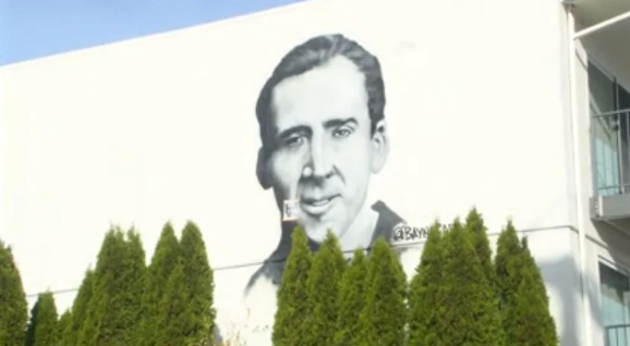 A mural featuring actor Nicolas Cage now adorns the south wall of the Olympic Villa Apartments
