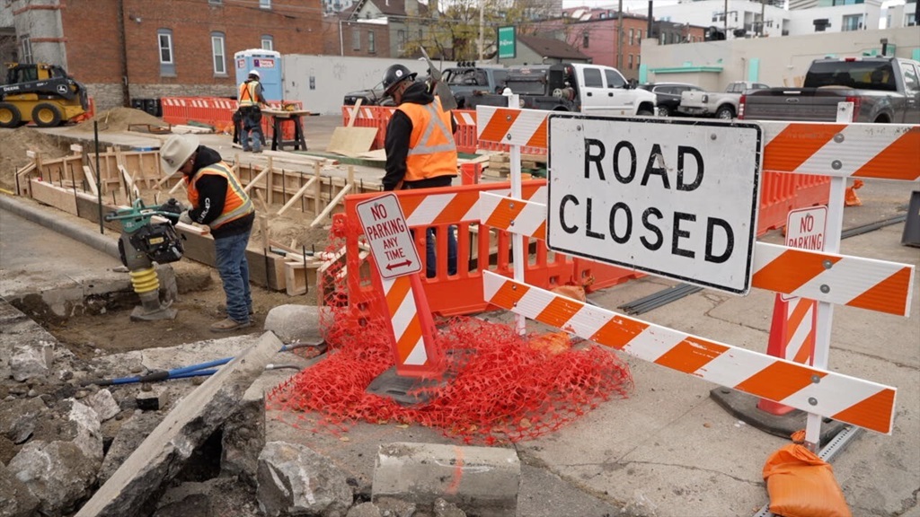 Patches of asphalt are being ripped up and replaced with gardens