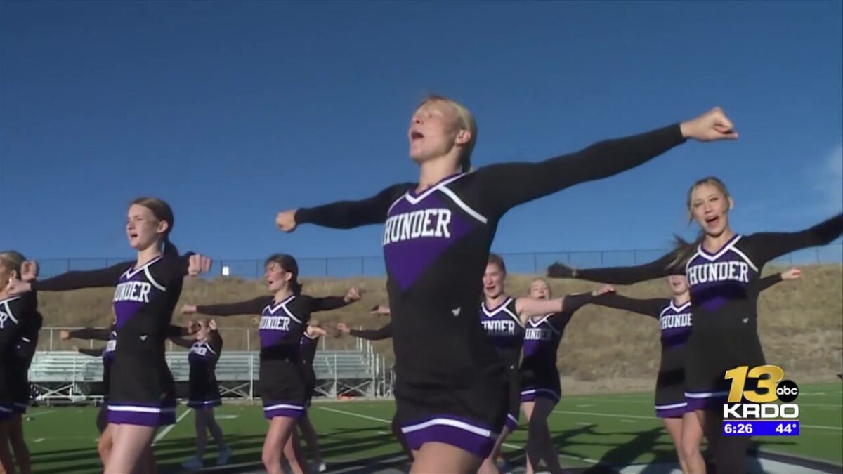 The Discovery Canyon cheer squad receives Qdoba Friday Night Blitz Spirit Award plaque