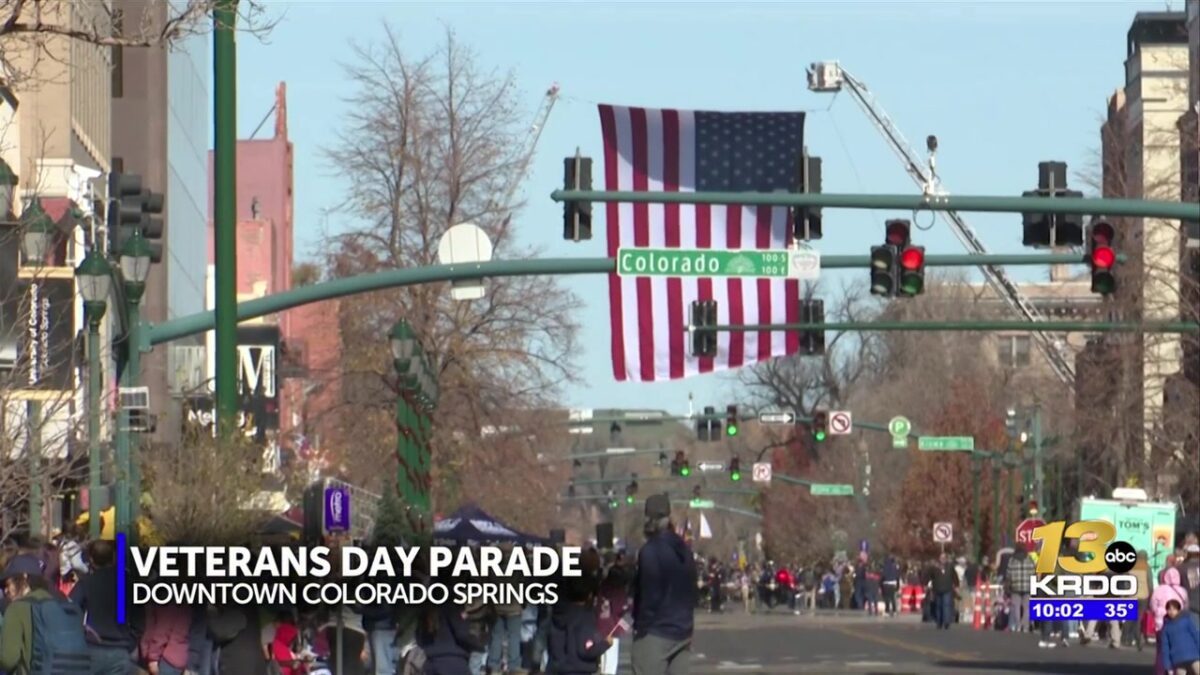Crowds waving flags gathered to honor those who served at Colorado Springs Veterans’ Day Parade