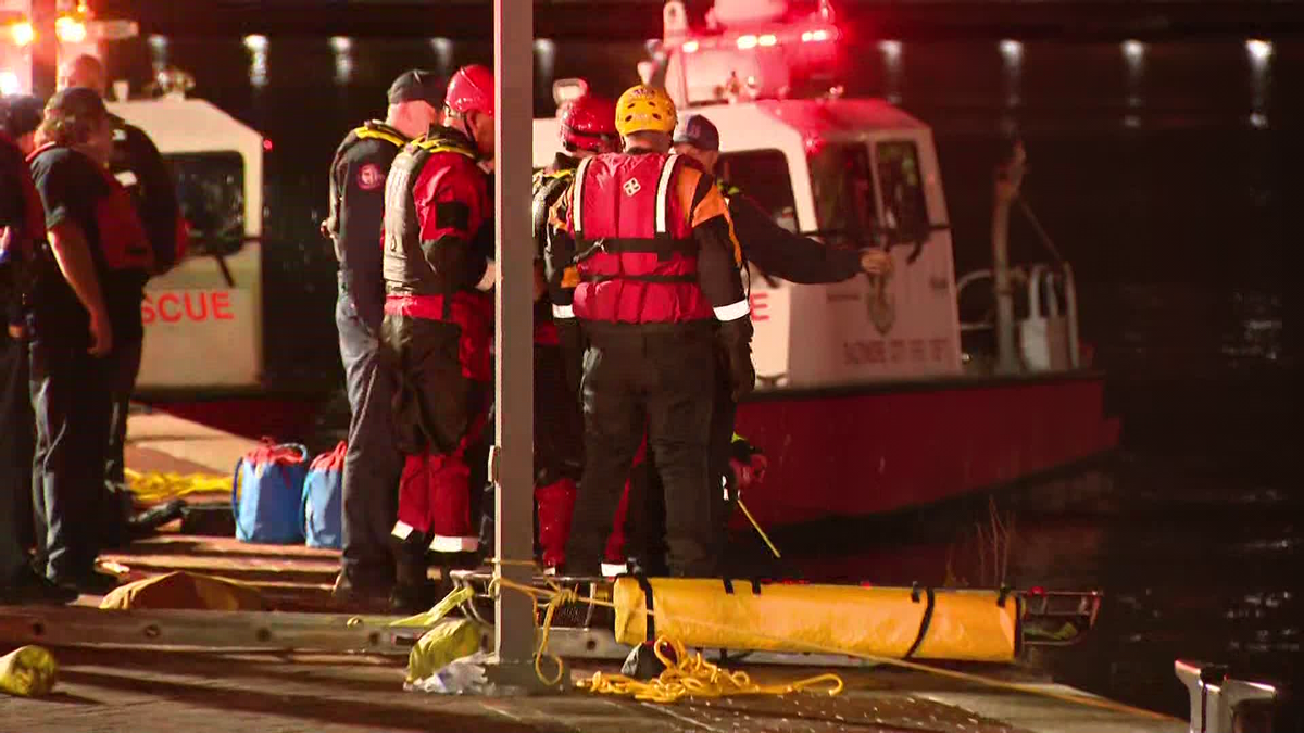 A woman was taken to the hospital Tuesday after a vehicle drove into the Inner Harbor
