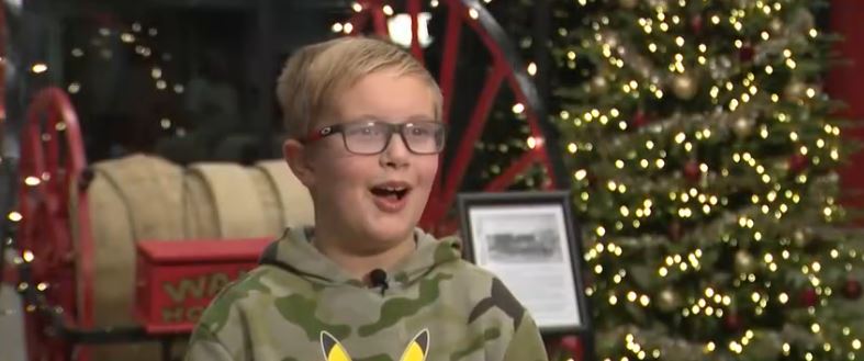 9-year-old Colton Holmes took part in a citywide contest that encouraged kids across the city to clear snow from the fire hydrants for a chance to ride to school in a fire truck.