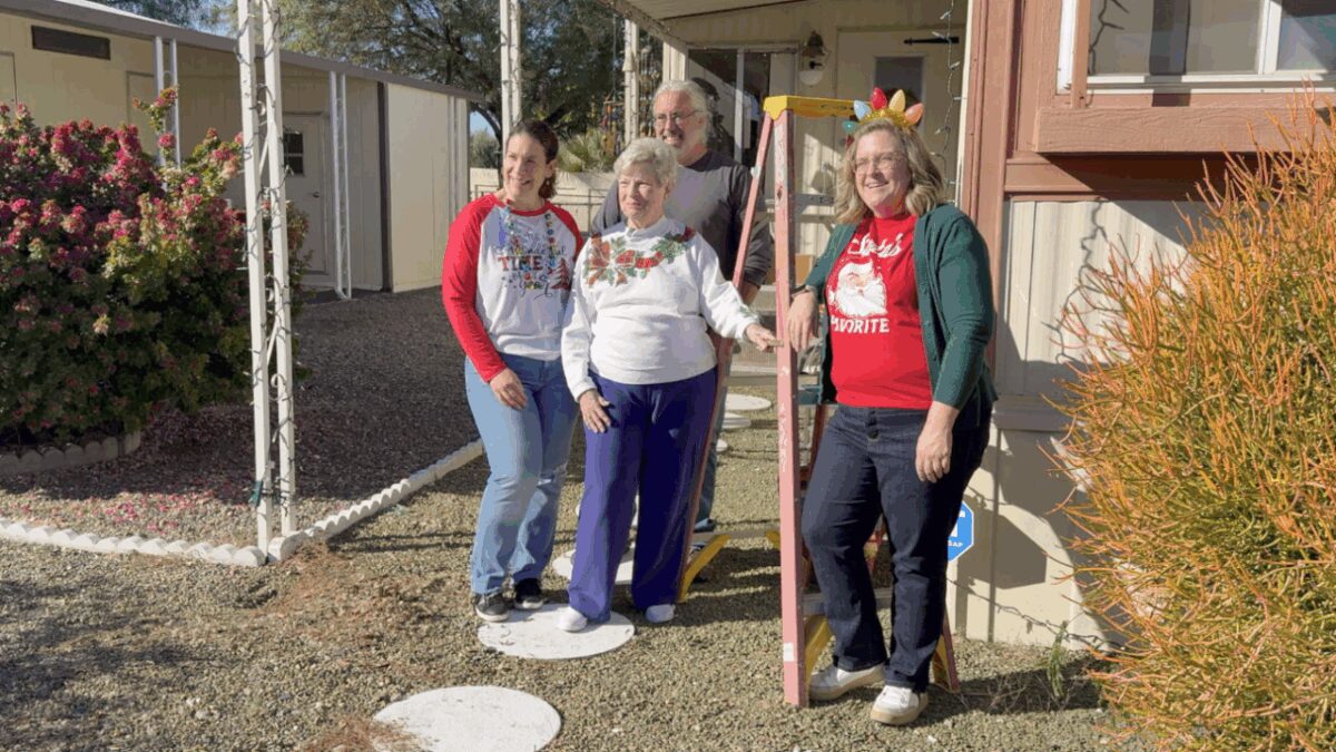 A group of neighbors came together to make sure Judy Enz’s home shined as bright as her holiday spirit.