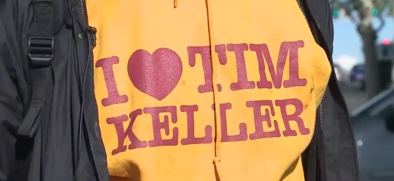 Large yellow sweatshirts reading "I HEART TIM KELLER" are showing up along Central Avenue