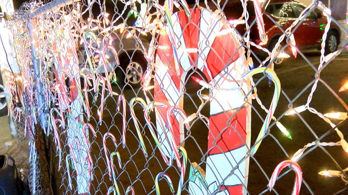 Neighbors spread holiday cheer one candy cane at a time