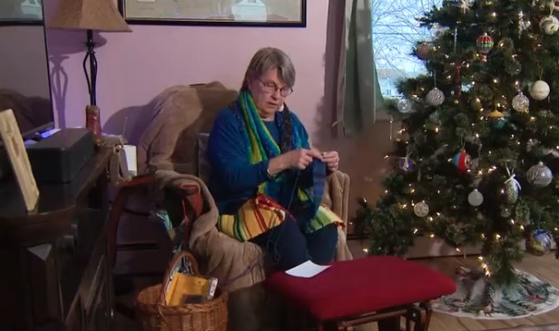A Baltimore County knitter's unique scarf is not only vibrant: Each color signifies the daily weather.  At a home on Cecil Avenue in Woodlawn