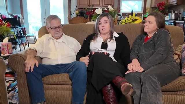 A Louisville mother accused in a decades-old abduction case is back in Kentucky and facing new charges