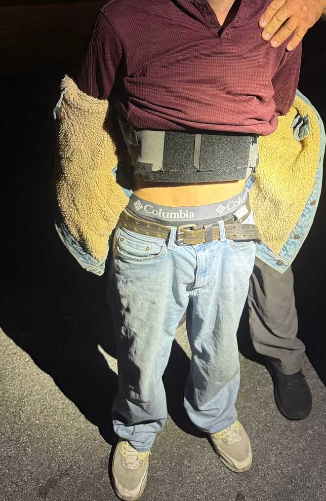 No charges were filed against a man detained during the Stuart Christmas parade after officers discovered he was carrying a gun and a dagger.