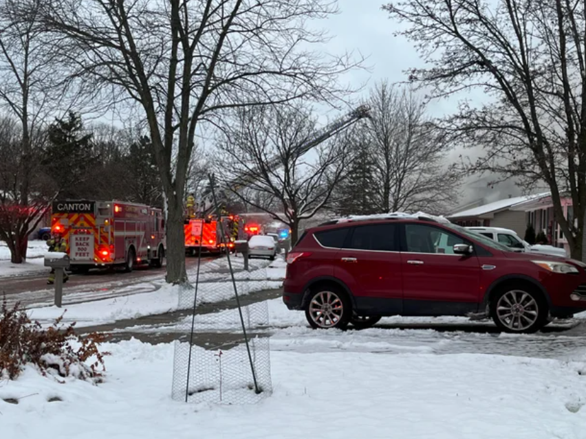 Fire trucks are lined up on the 43000 block of Fredricksburg Street in Canton Township