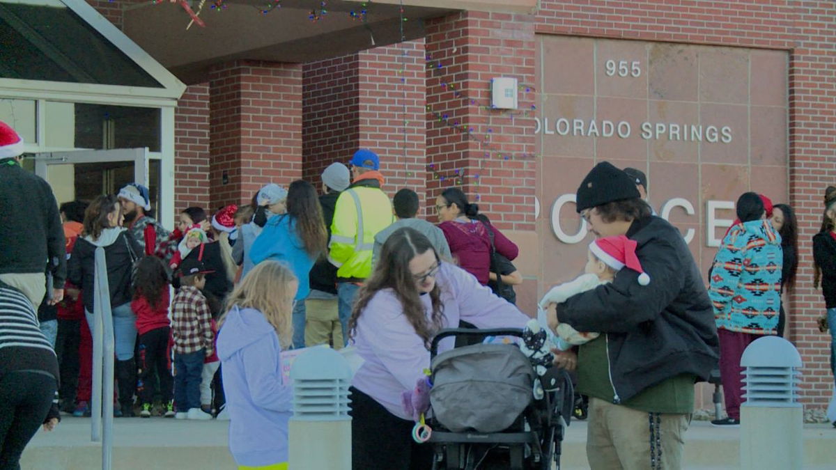 Families line up around the block for Holiday on the Hill at Colorado Springs Police Department