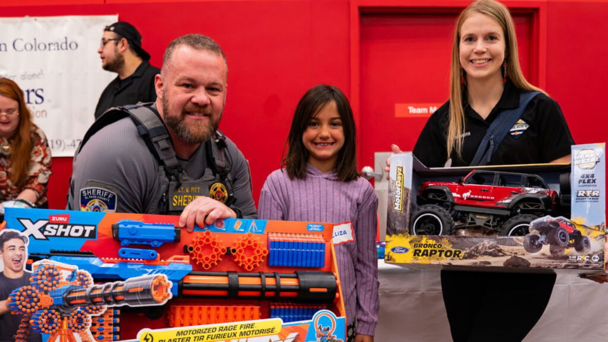 Families impacted by chronic diseases & illness paired with law enforcement for Shop-With-A-Cop