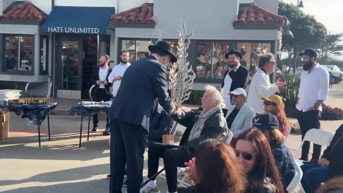 Rabbi from Australia shares thoughts during Light up The Harbor in Ventura