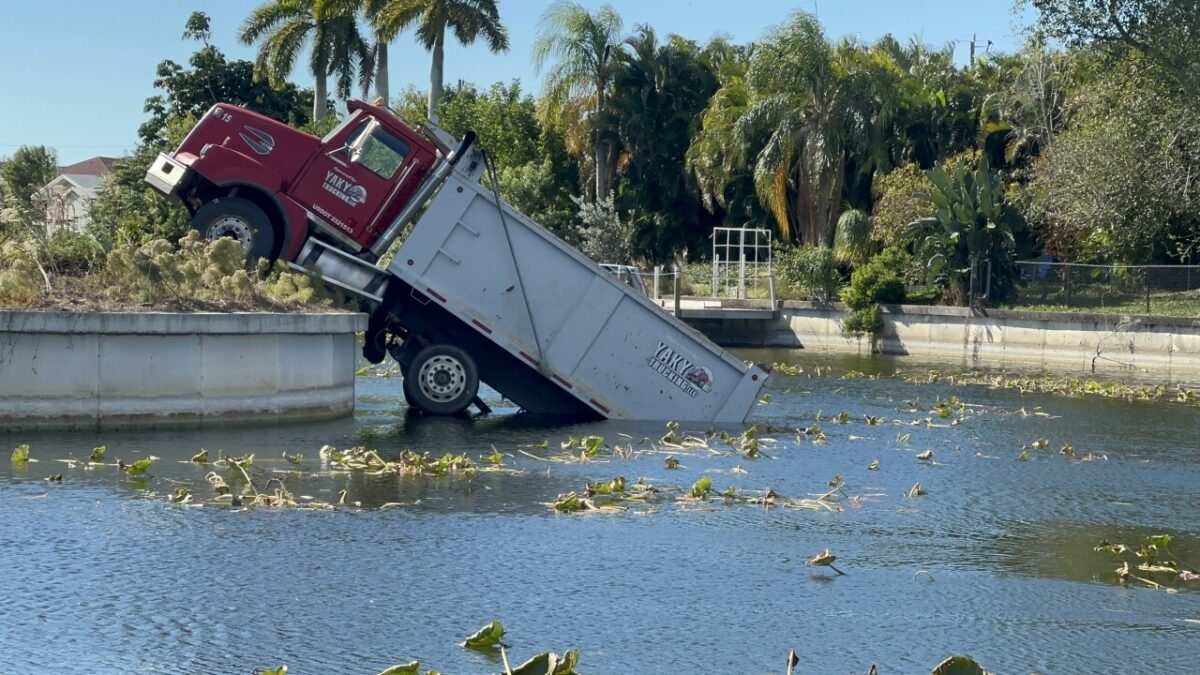 A construction truck ended up halfway submerged in a Cape Coral canal on December 30.