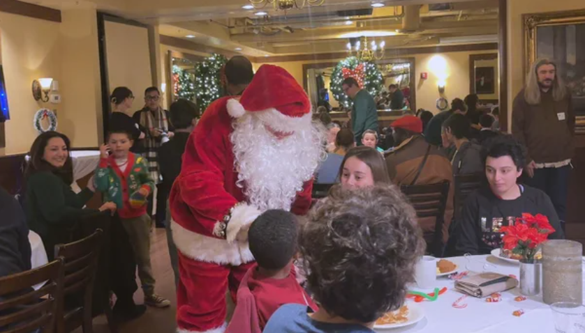 Santa speaks with guests at Autism Eats event at Maggiano's Little Italy.