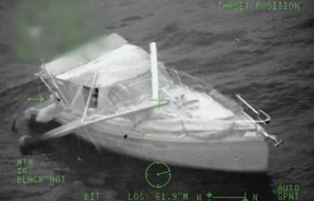 Video captured the moments when two boaters were rescued early Wednesday morning after their sailboat's mast broke on the rough waters off Florida's Gulf Coast