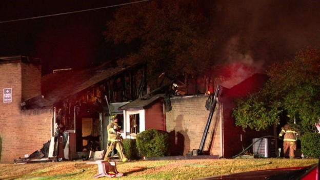 A 90-year-old North Texas woman is in the hospital after a fire tore through her apartment building overnight.