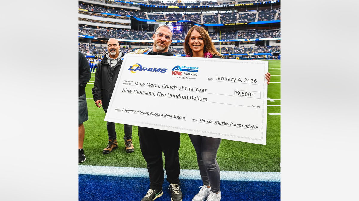 Pacifica head football coach Mike Moon is honored by the Los Angeles Rams