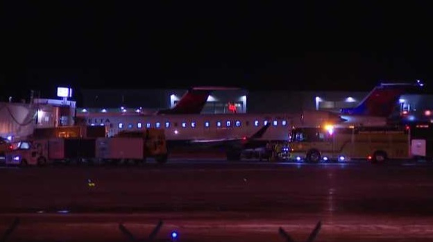 An Endeavor Air flight made an emergency landing at Eppley Airfield after a crack was discovered in the left side window during descent.
