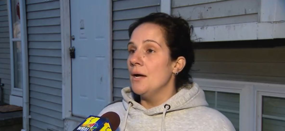 Ashley Gubernat and her family saw what was left of their home after she and her two children were rescued by neighbors while her house was burning Tuesday morning in Middle River.