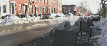 Baltimore Mayor Brandon Scott says reserving shoveled parking spaces across the city won't be tolerated.