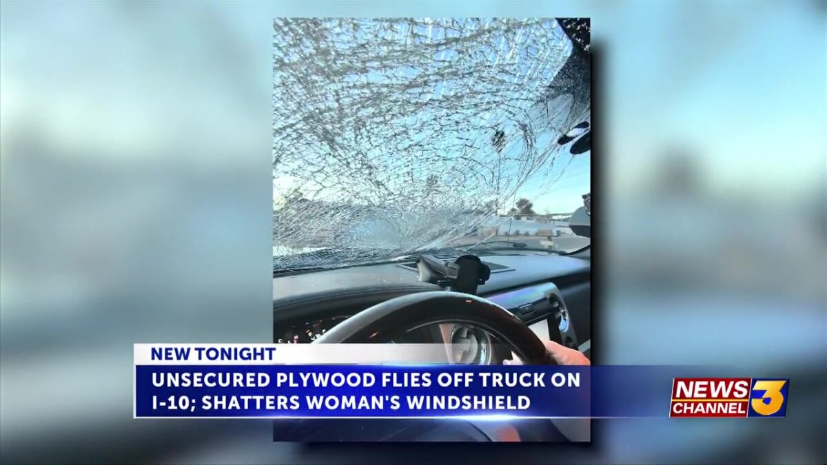 Unsecured plywood flies off truck on I-10