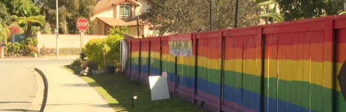 A man who helps maintain the well-known Pride fence in Scripps Ranch narrowly escaped being hit by a car Saturday night in what police are calling a hate crime.