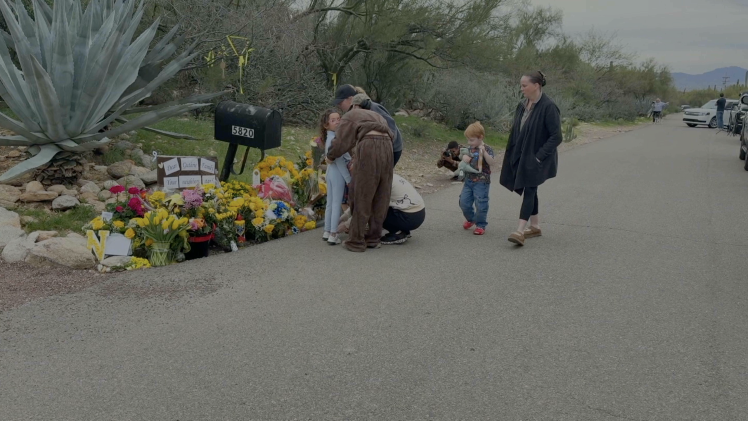 Flowers continue to grow outside the home of Nancy Guthrie