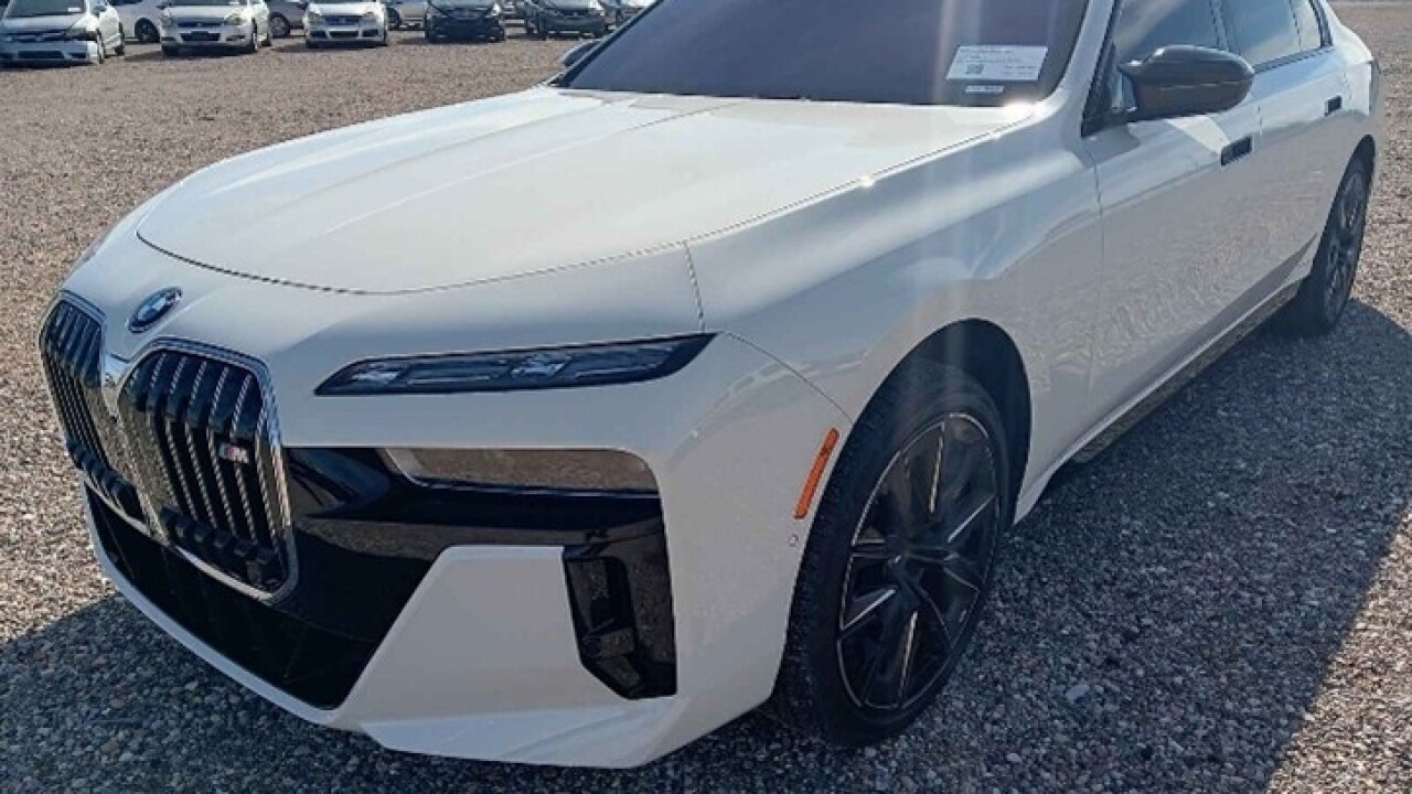 An indictment alleges a couple used the fraud proceeds to purchase luxury vehicles and real estate.