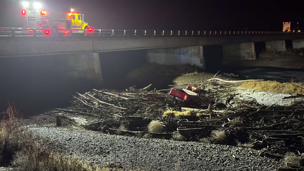 Pickup ends up in Snake River after driver swerves to avoid deer