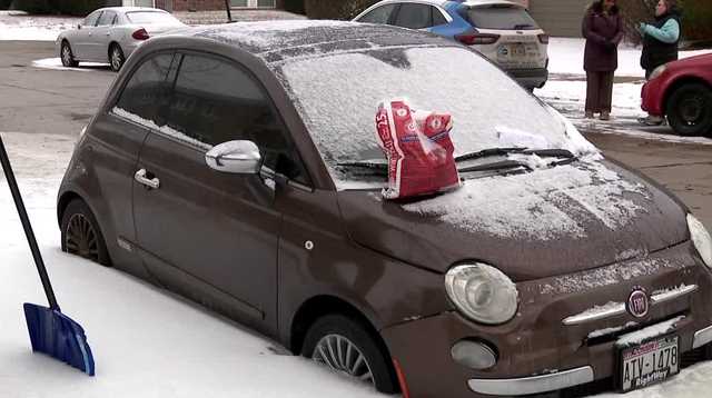 Chris Daugherty's car has been stuck in ice outside her Racine apartment for over a week
