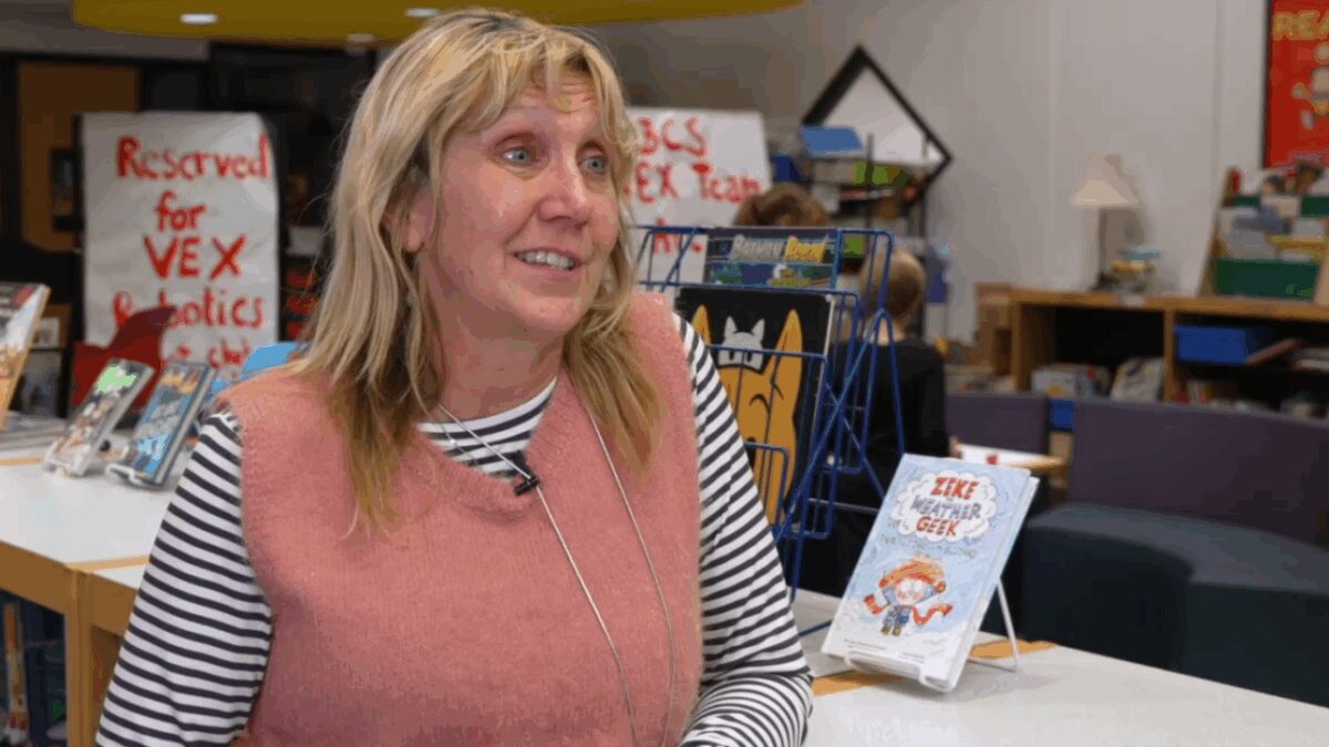 Students at Birmingham Covington School are signing the news literacy pledge — promising to pause